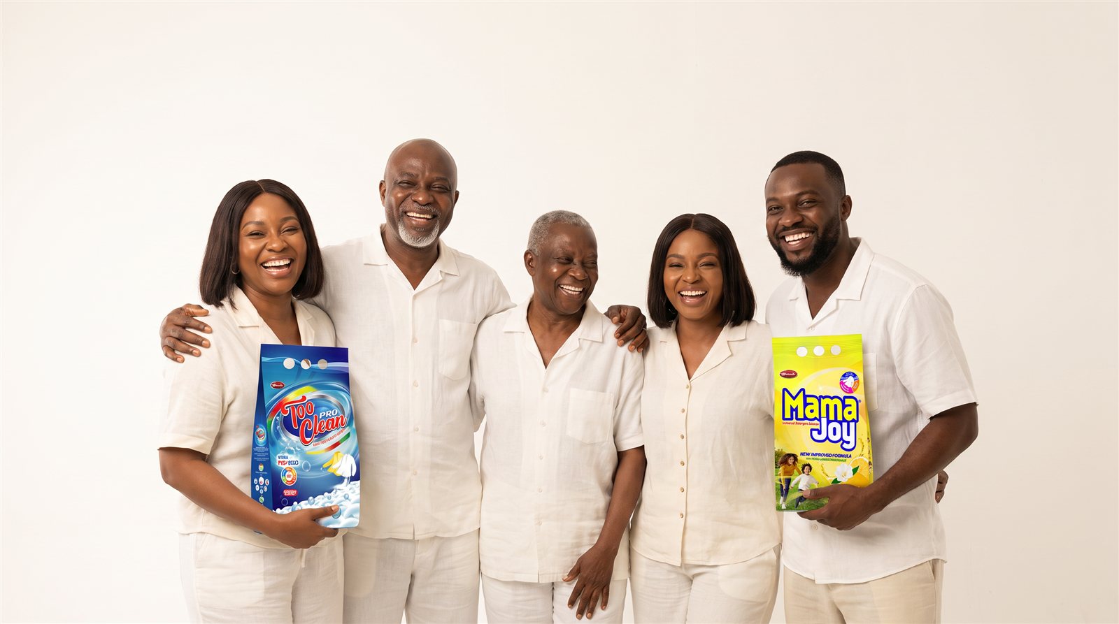 Five happy Nigerian customers of different generations laughing together, holding Too Clean Pro and Mama Joy packs